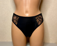 Black tanga panties with elegant lace detailing