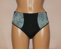 A pair of light blue floral pattern classic panties. The main colour is black with floral accents.