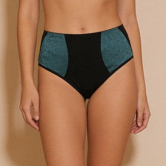 Teal and black bikini set on a beige background