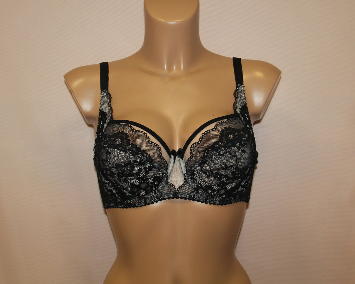 A black lace soft cup bra with side support. It has adjustable straps.