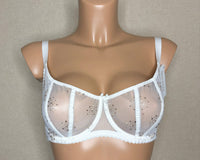 Soft cup bra with elegant fabric design with see-through detailing.