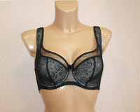 A half padded bra in grey colour, featuring underwired support, cotton lining on the lower part of cups, and adjustable padded straps.