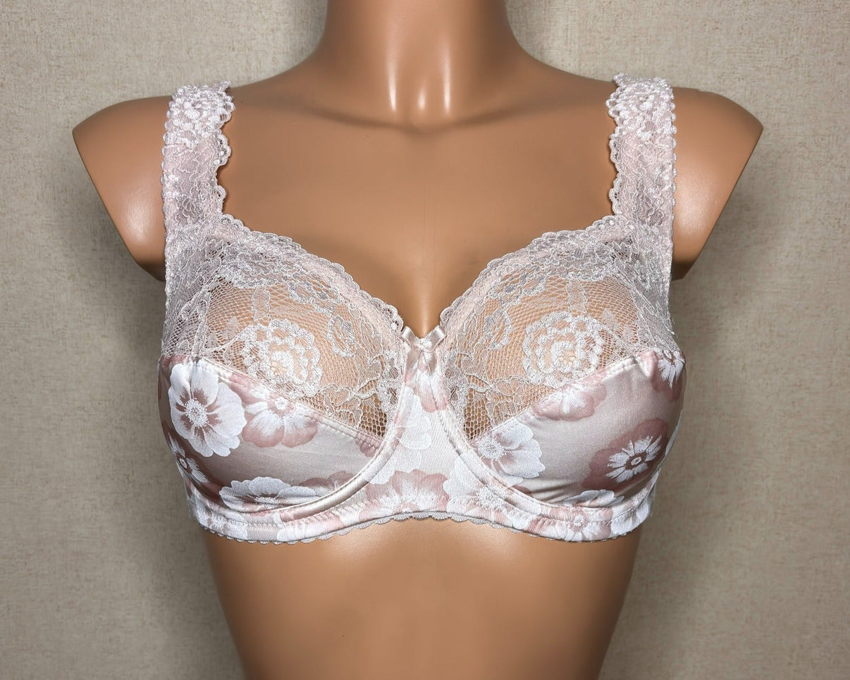A light beige colour soft cup bra with floral pattern.