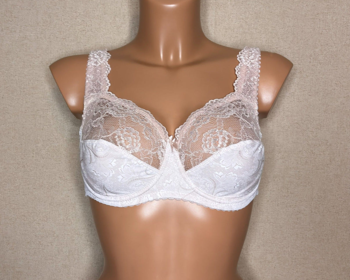 A light beige color soft cup bra with floral pattern.