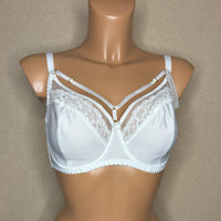 A white soft cup bra with lace cups, adjustable straps, and extra side support.
