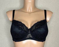 A black lace half padded bra with adjustable straps.