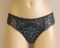 Woman's black lace panties with a medium waist.