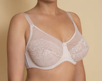 Light beige lace bra with adjustable straps.