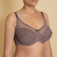 Brown lace bra with underwired support and adjustable straps.