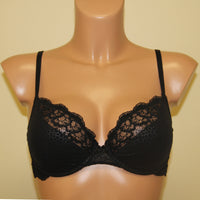 A black half padded bra with underwired support and lace detailing.