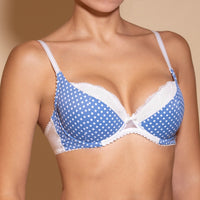 A blue push-up bra with white dots pattern and adjustable straps.