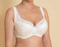 A woman's ivory floral design half-padded bra with adjustable straps and lace detailing.