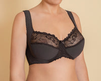 A woman's brown bra with soft cups and underwired support, featuring a lace pattern and adjustable straps.