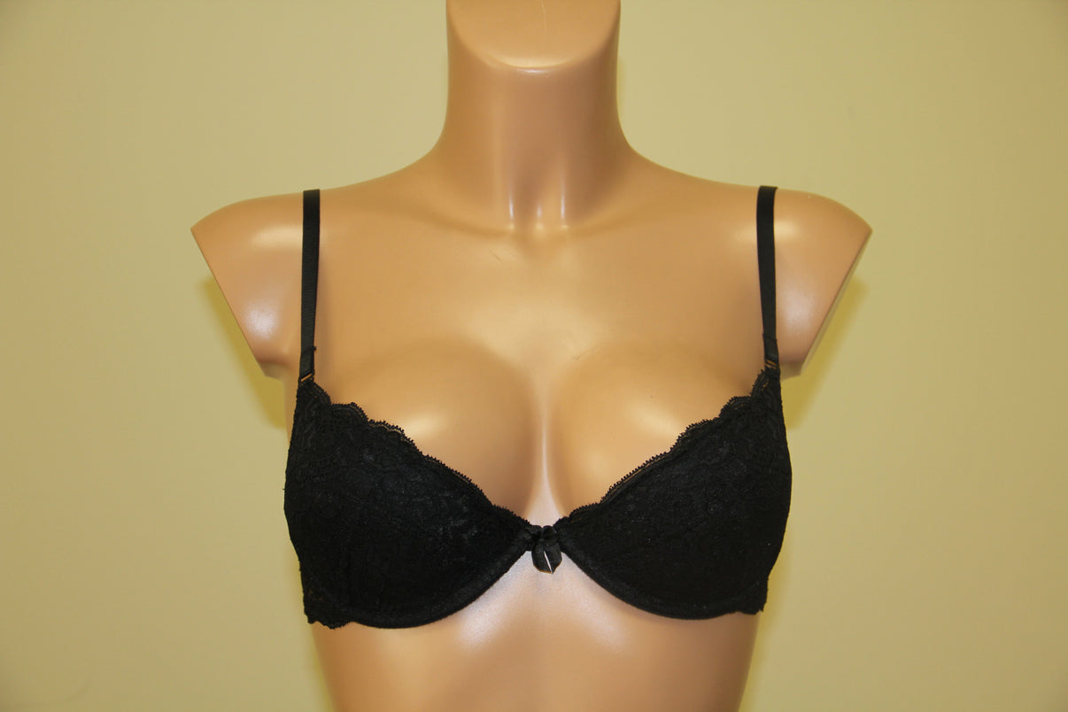 A black push-up bra, featuring underwired support, cotton lining on cups, and adjustable straps.