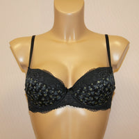 A black push-up bra with lace detailing and adjustable straps.