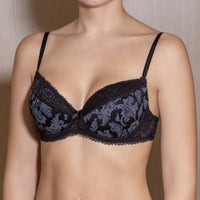 Black push-up bra with floral lace pattern on the cups and adjustable straps.