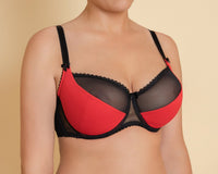 Woman's red half padded bra with black straps and red & black multicolour parts.